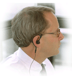 Man using a cellular phone with a headset